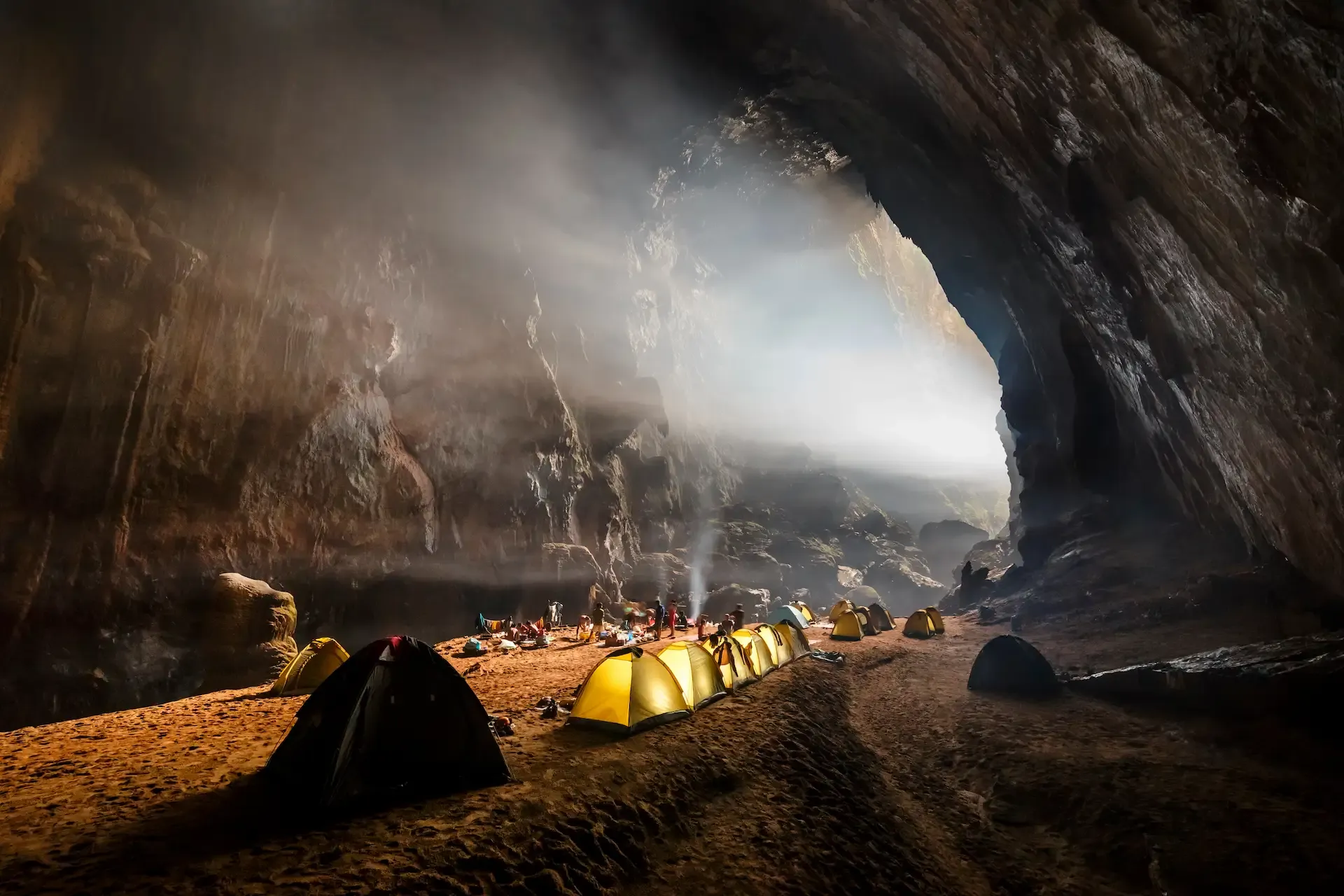 Sunlight streaming down on the campsite in Son Doong Cave