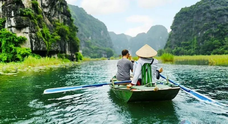 Tourists on a Boat Trip of Tam Coc in Ninh Binh, Vietnam