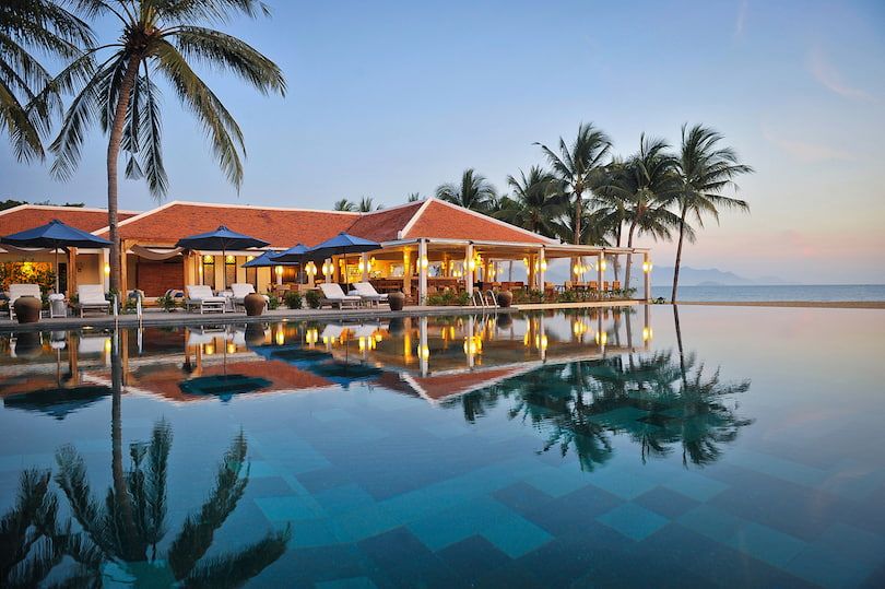 5. a Resort With an Infinity Pool by the Beach at Sunset in Vietnam.