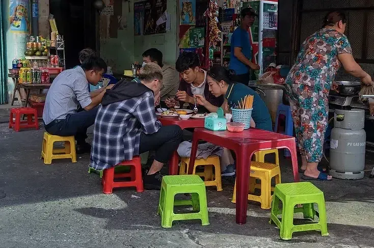 Famous Red Stools Used Sitting in Vietnam Public While Eating and Drinking With Friends