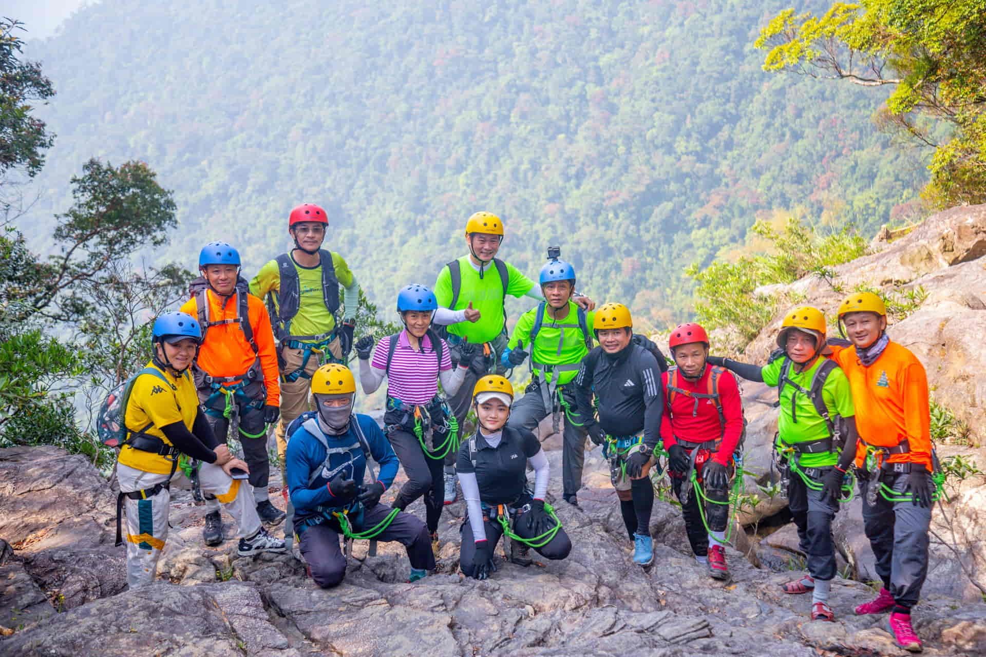 Visitors having fun while participating in the Do Quyen Waterfall tour
