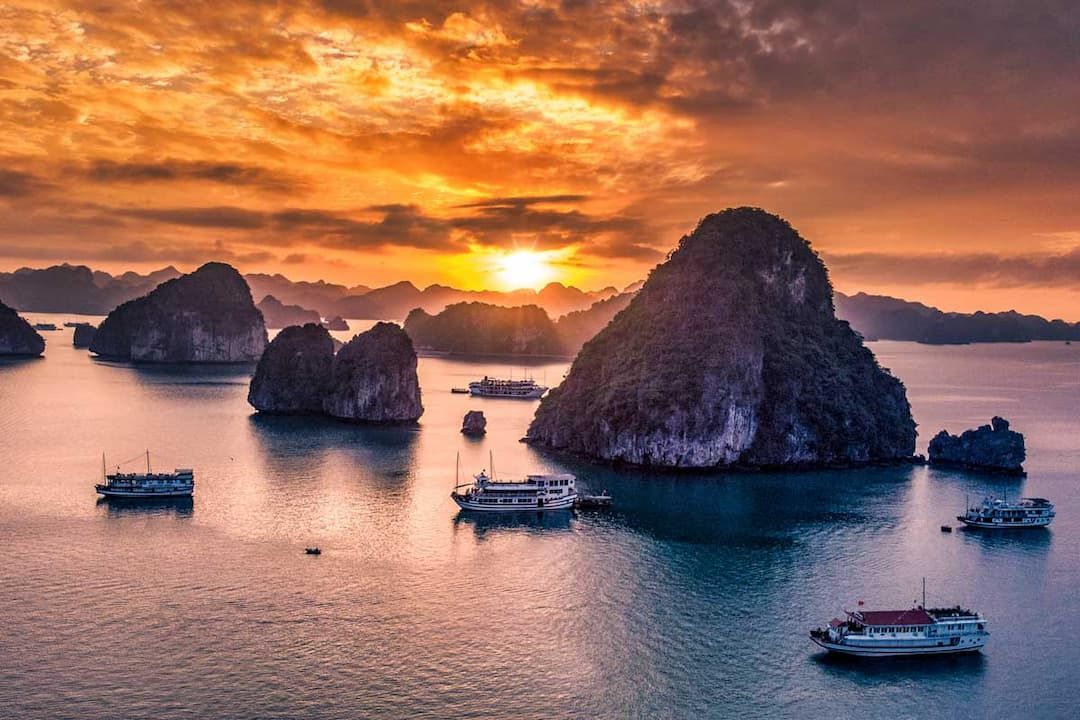 Sunset Over Ha Long Bay, Vietnam, With Cruise Boats and Limestone Karsts
