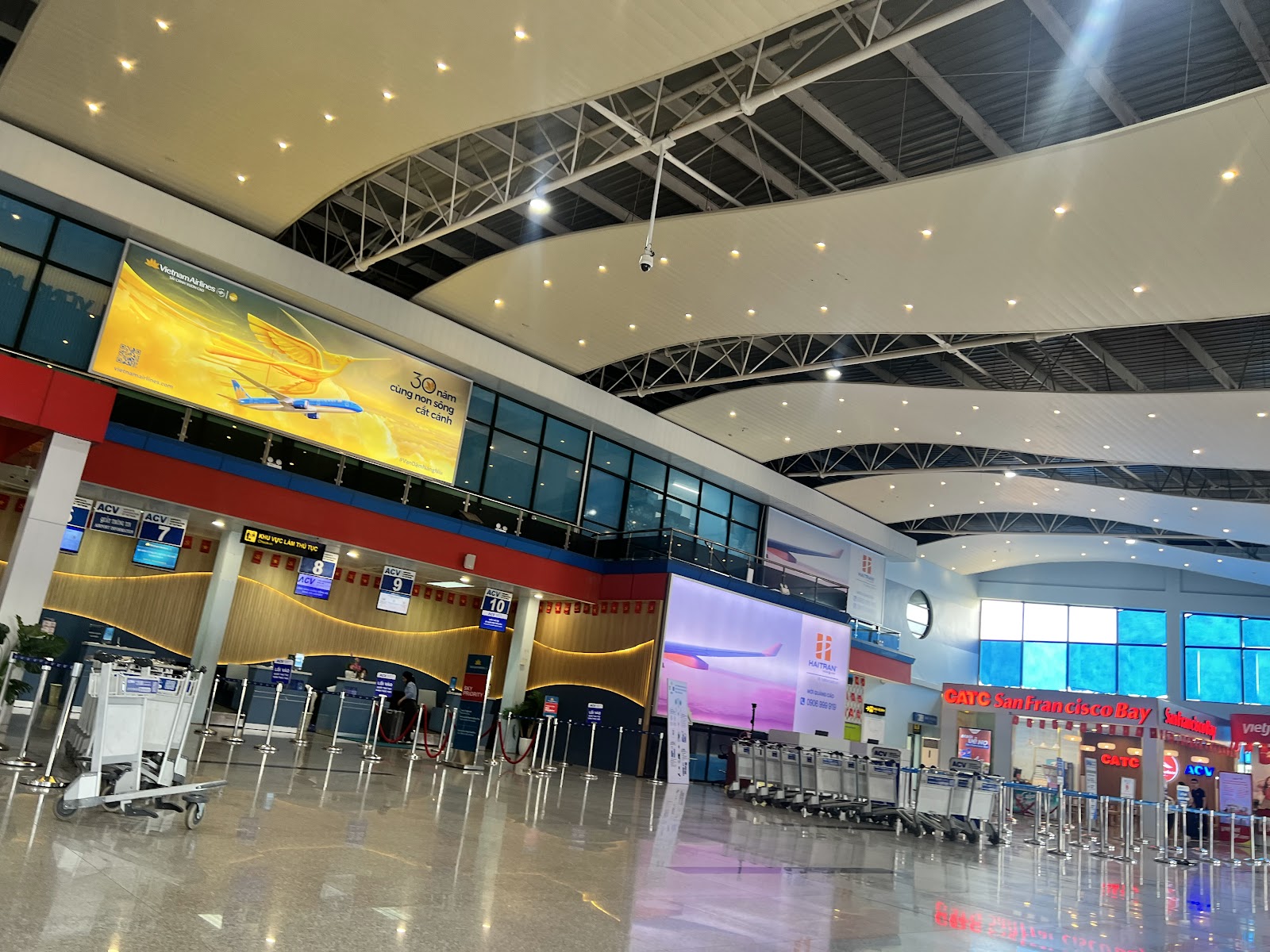 Departures hall at Dong Hoi Airport with check-in desks and no retail counters