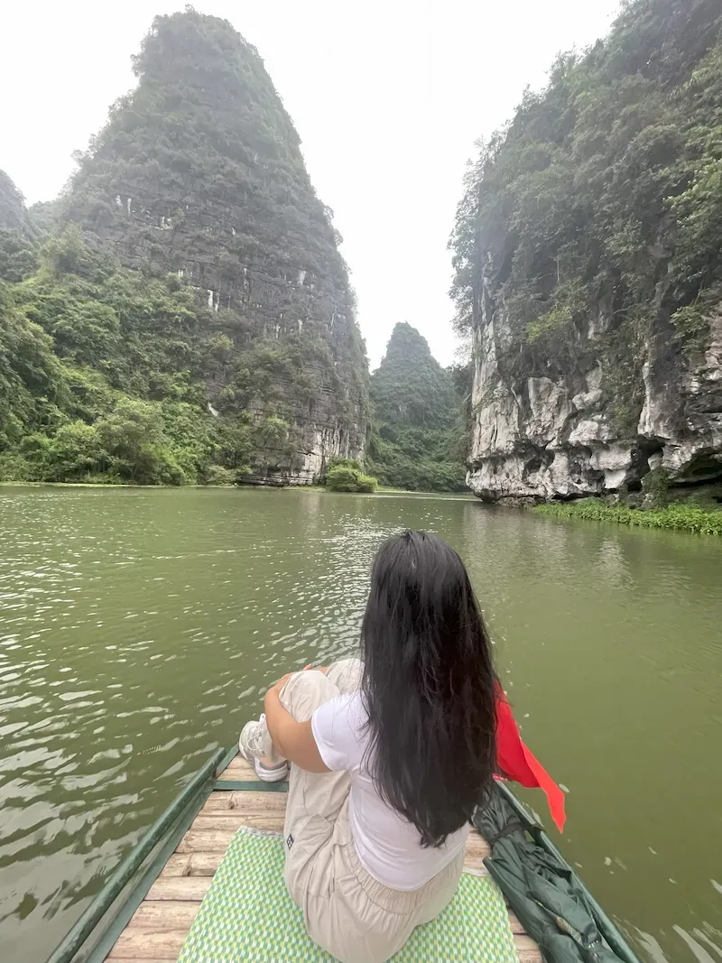 a Tourist Enjoying the View While on a Trang an Boat Tour