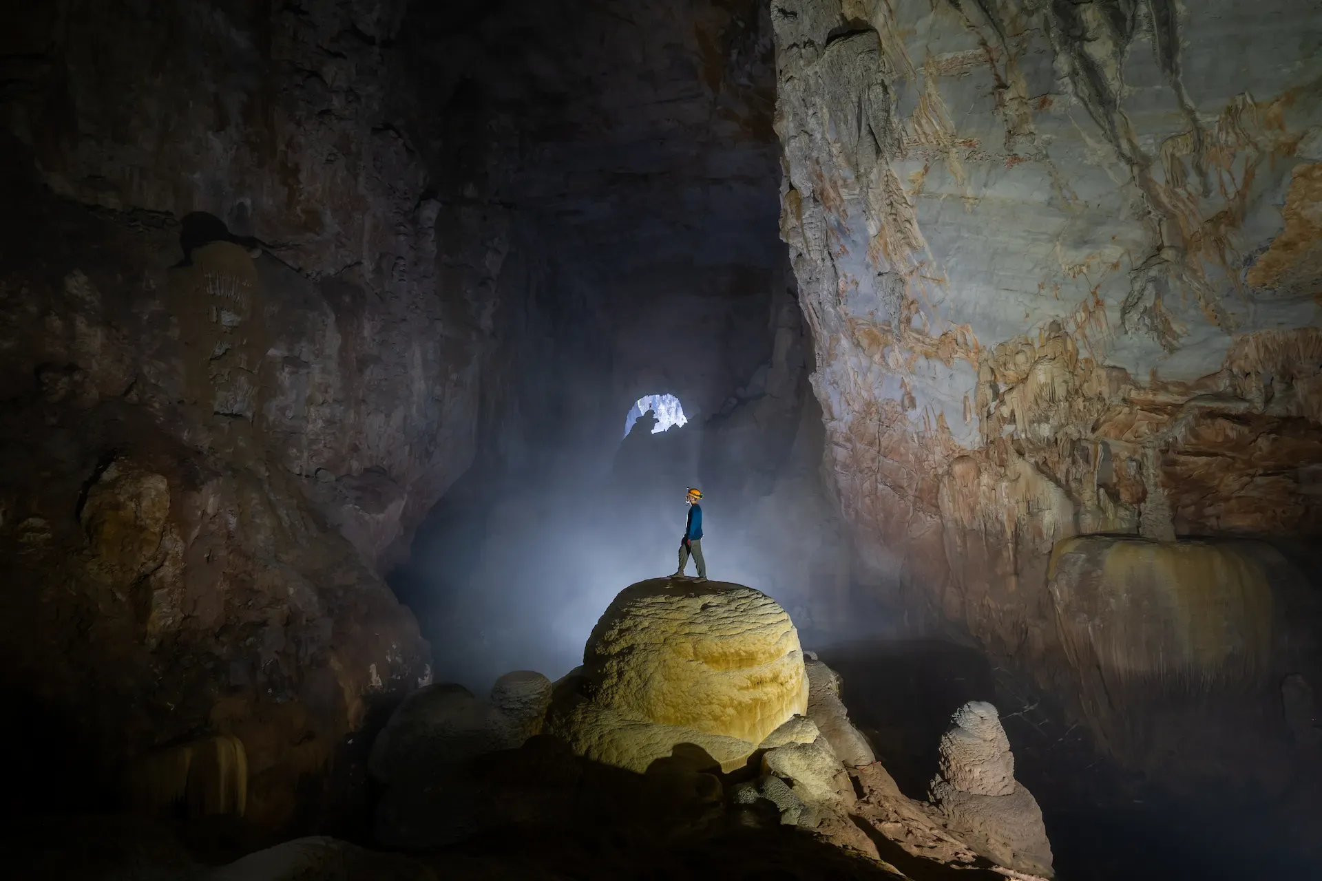 Humans dwarfed inside Son Doong's widest chamber