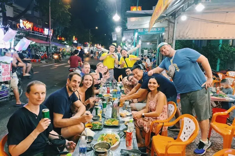 Tourists Enjoying Food Tour in Ho Chi Minh City