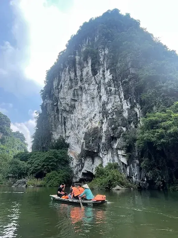 Trang An limestone caves boat tour Kong Skull Island filming location Ninh Binh Vietnam