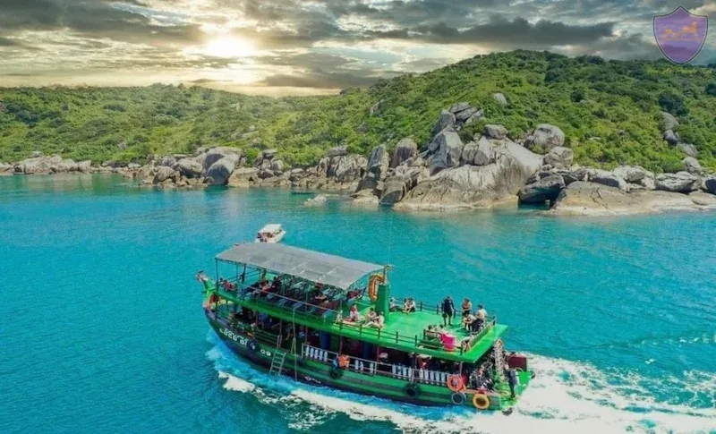 Tourists Relaxing on a Private Charter on Their Cham Island Tour