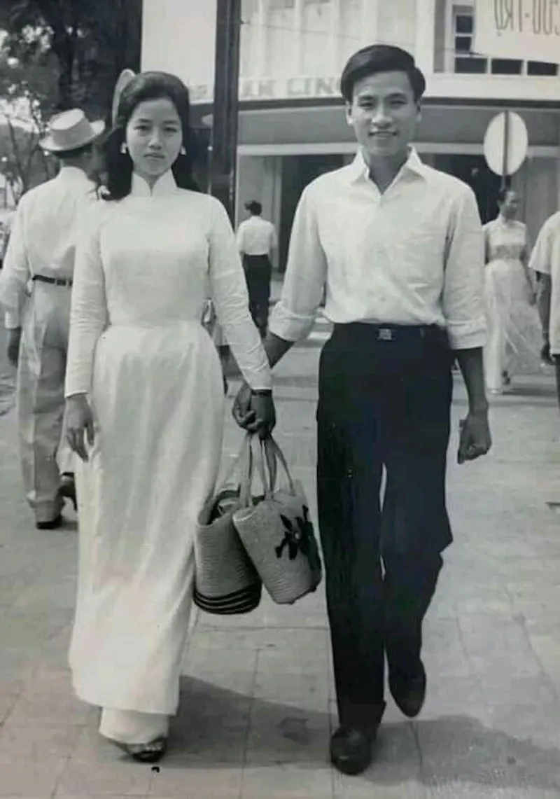 Traditional white Ao Dai with vintage style, long tunic showing Vietnamese cultural dress elegance and grace