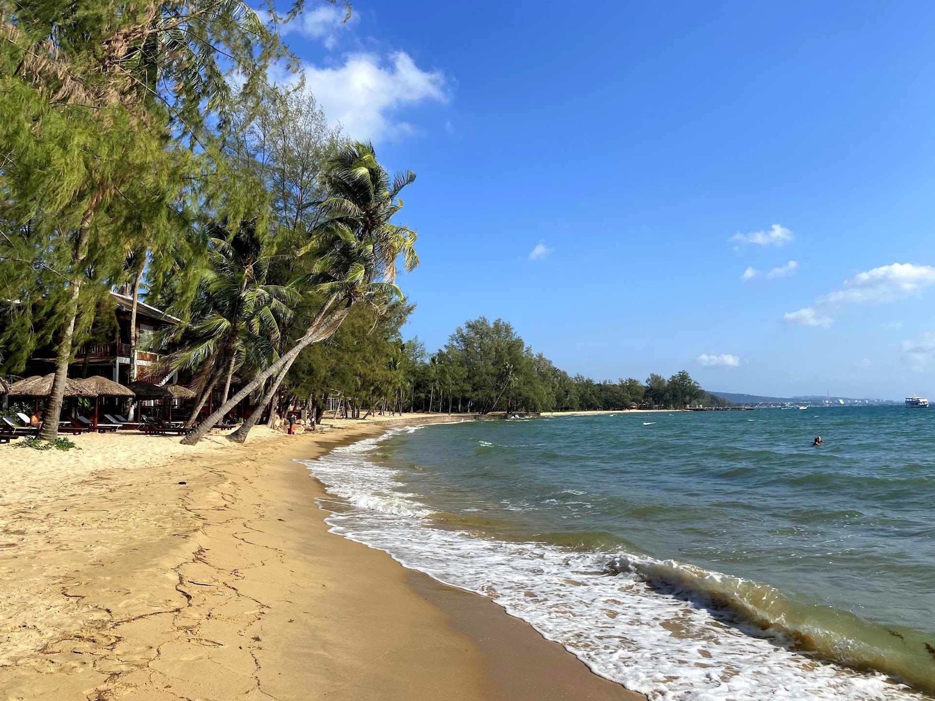 Palm trees lining sandy Ong Lang Beach beside the sea on Phu Quoc