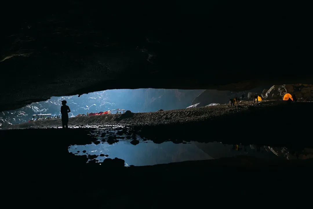 Hang En Cave massive opening with camping site inside world's second largest cave at Phong Nha Vietnam