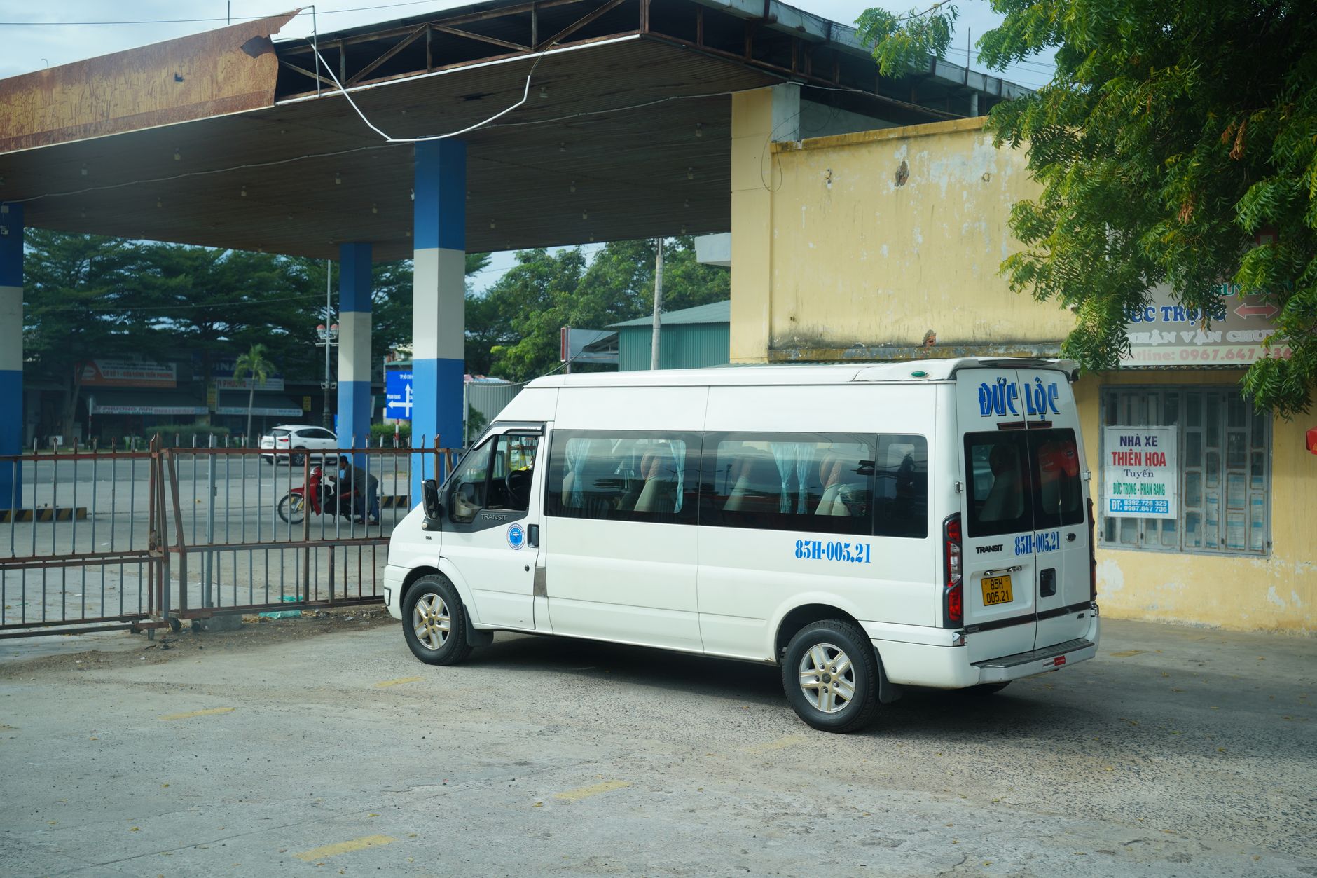 Passengers boarding a local bus at a roadside stop in Quang Tri province