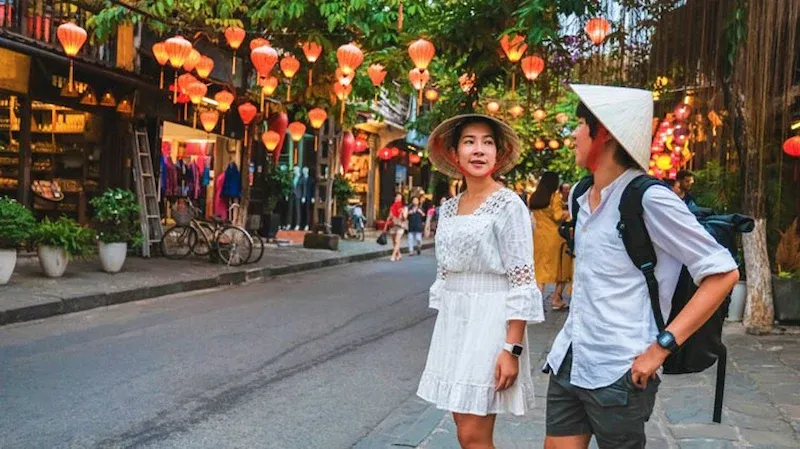 a Tourist Couple Strolling Through Hoi an Street