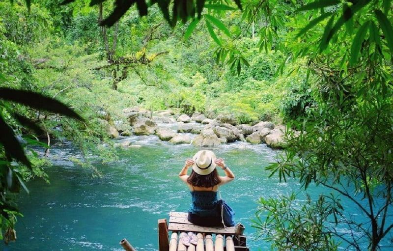 a Woman Relaxing at a Picnic Spot in Mooc Spring, Phong Nha