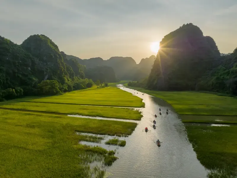 2. Tam Coc Overview With River Flowing Between the Mountains in Ninh Binh