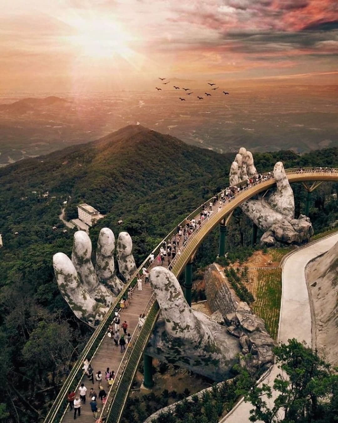 6. a View of the Golden Bridge in Da Nang Supported by Giant Stone Hands With a Sunset Sky.