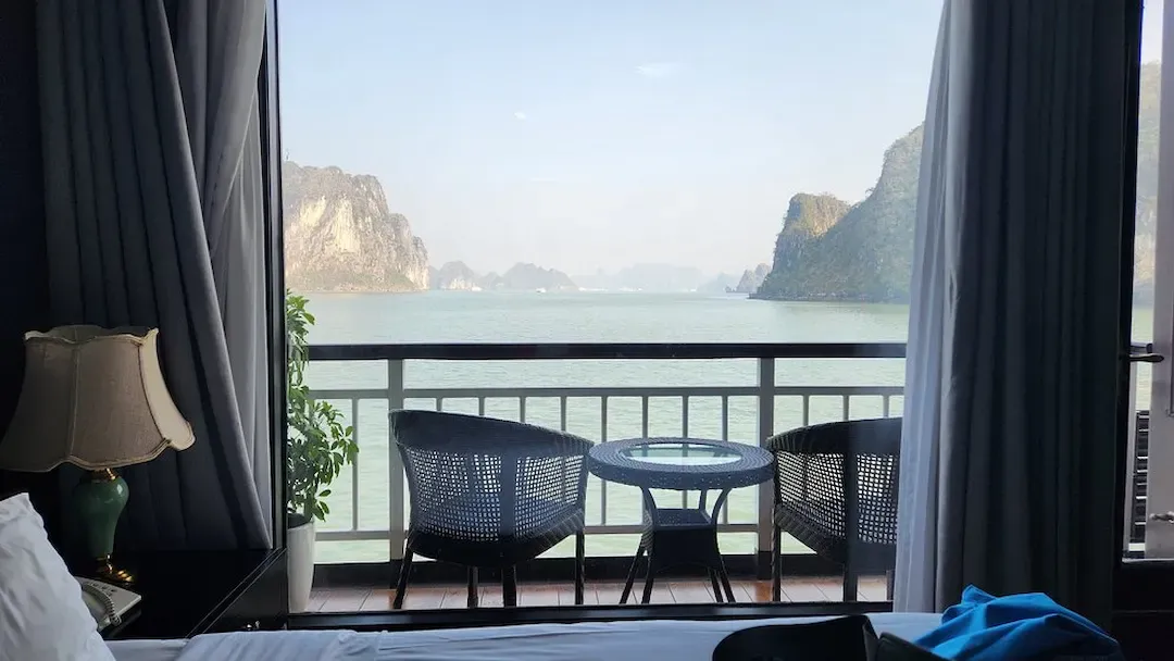 This Shows the Upper Deck Railings and Rigging of a Traditional Vietnamese Junk Boat, With the Scenic Lan Ha Bay Landscape Visible in the Background.