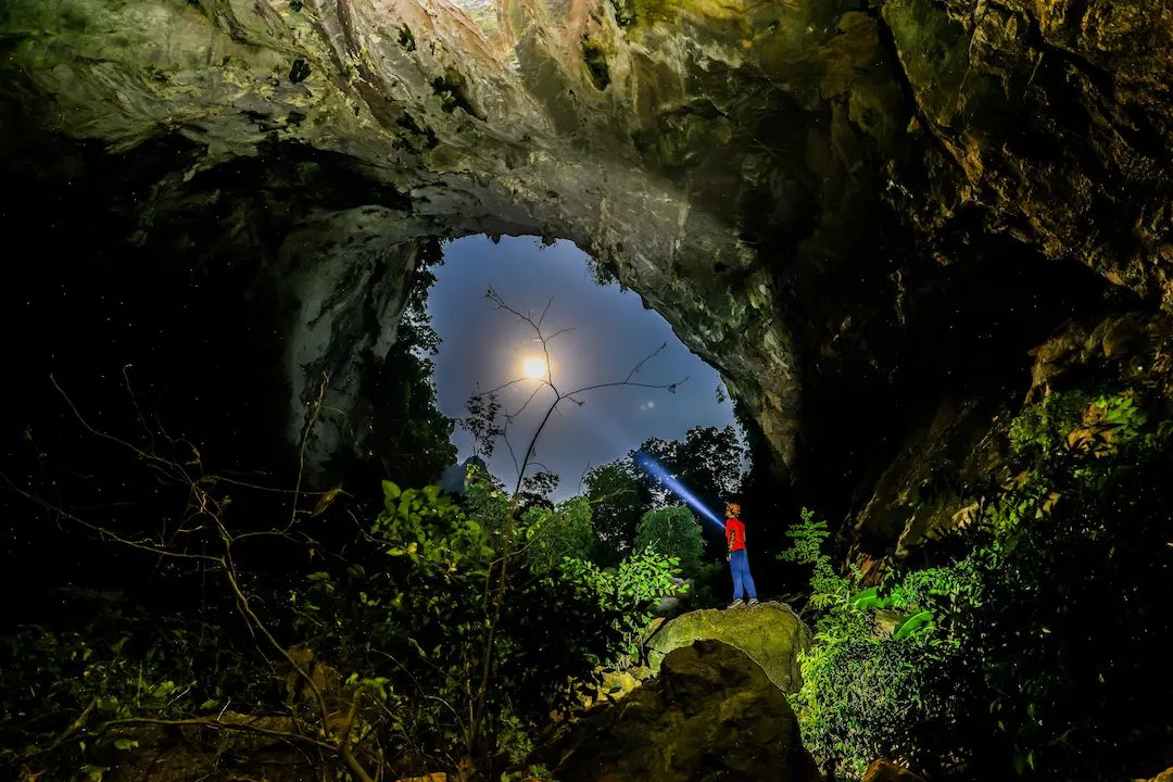 Overnight camp inside Hang Pygmy cave on a jungle expedition in Phong Nha