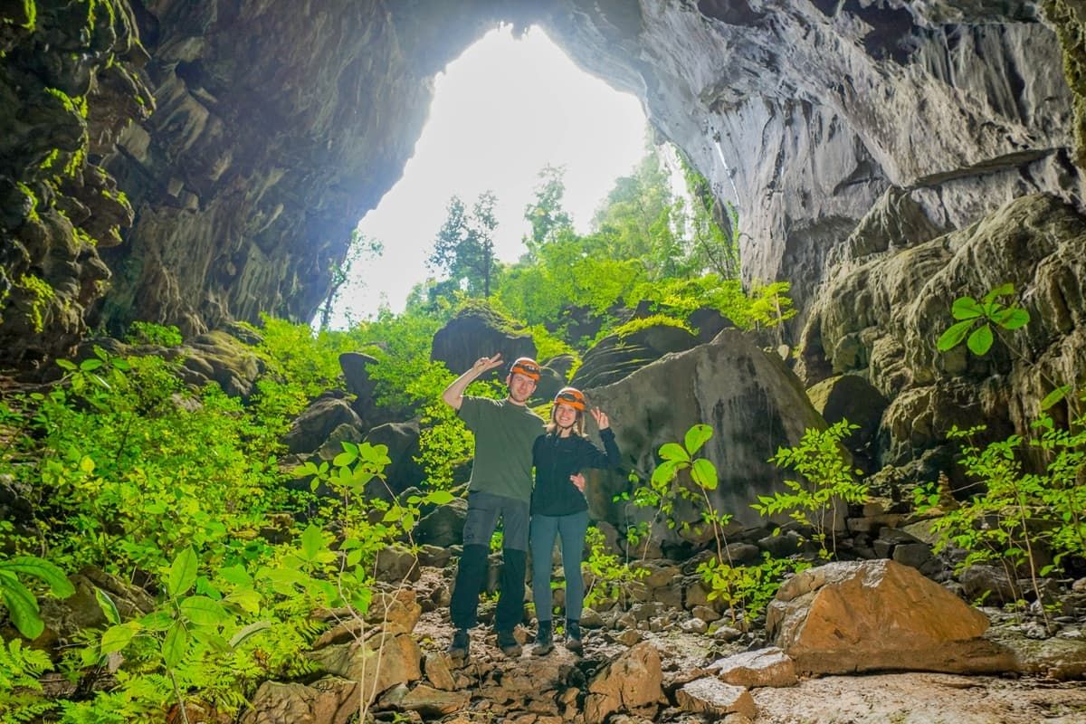A couple taking photos at Elephant Cave of Phong Nha
