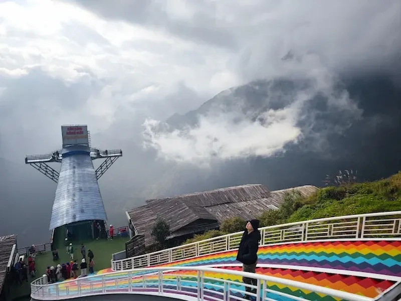 Sapa Glass Bridge Viewpoint With Rainbow Stairs and Misty Mountain Clouds