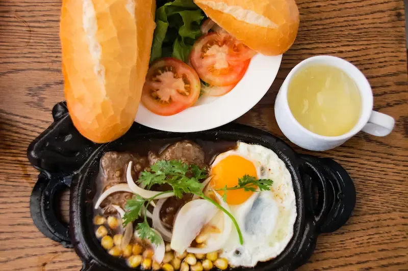 6. a Meat Lovers Favorite  Bo Ne or Sizzling Beef Steak in English