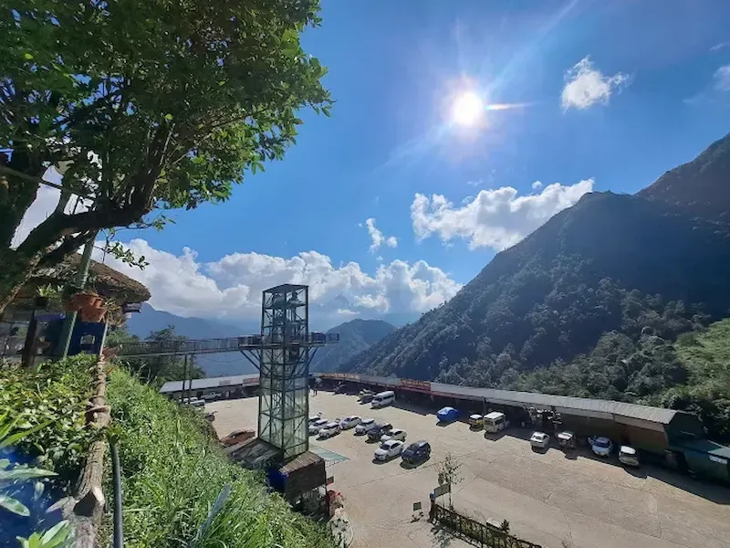 Parking Area and Glass Elevator Tower at Cầu Kính Rồng Mây Viewpoint Under Bright Sunny Sky in Sapa