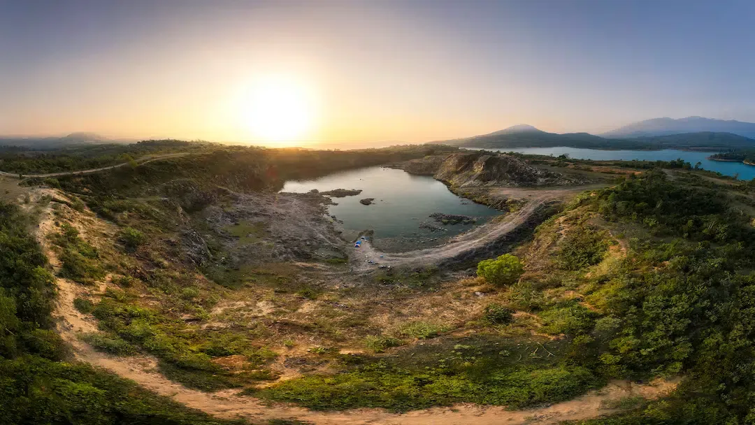 Panoramic sunset view over a peaceful lake in the Khe Sanh highlands of Quang Tri Province