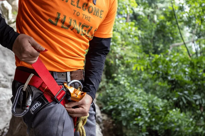 Guide checking rope and harness before a rope descent