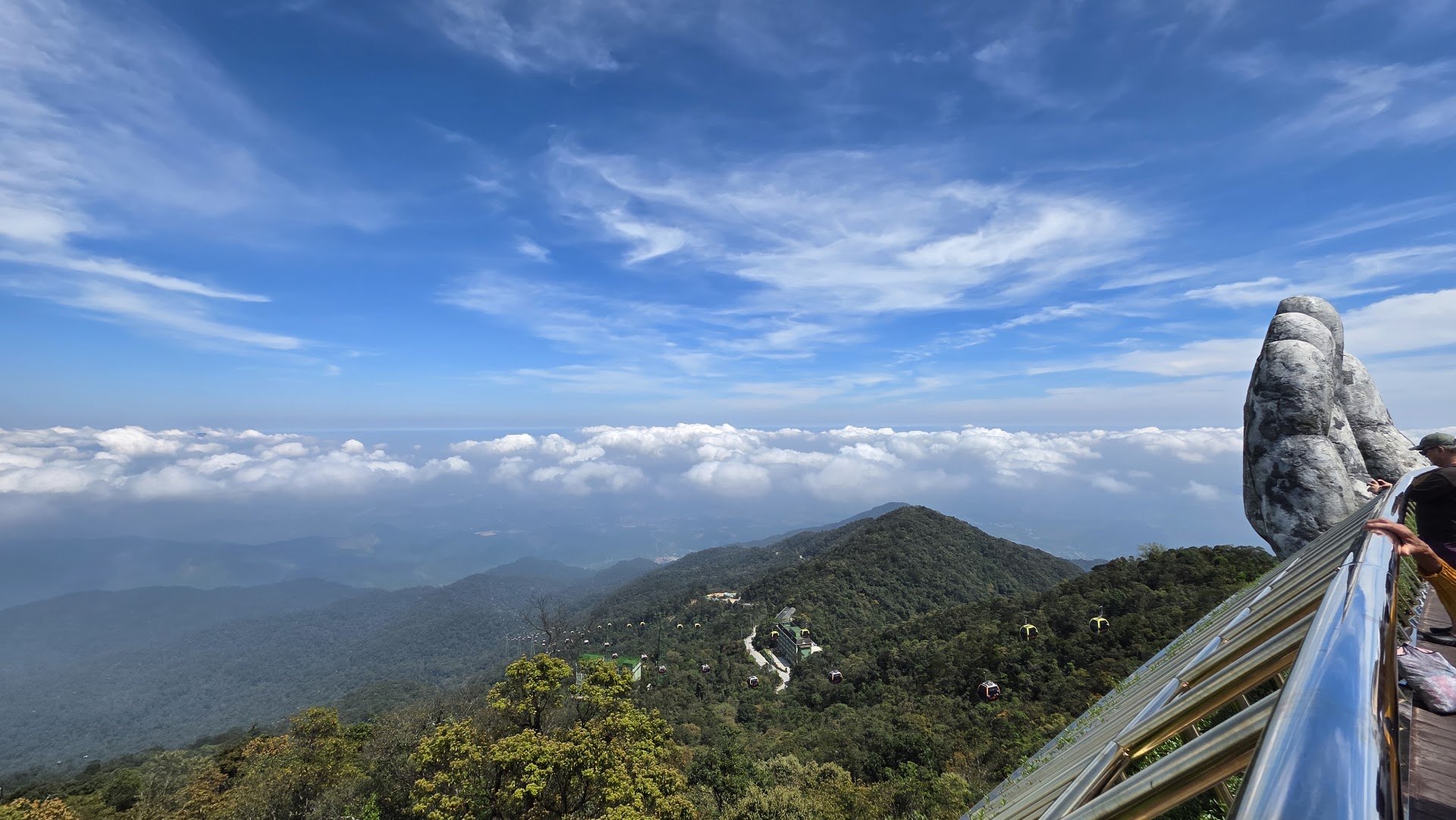 Mountain view from the Golden Bridge with a stone hand and cable cars