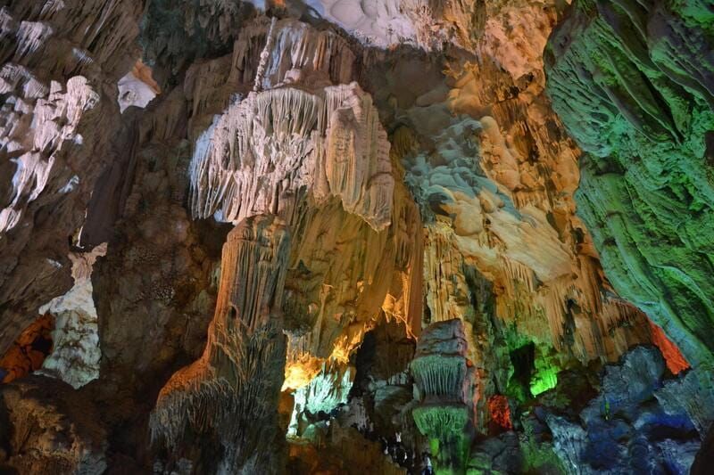Dramatic Cave View From Inside Dau Go Cave Overlooking Halong Bay.