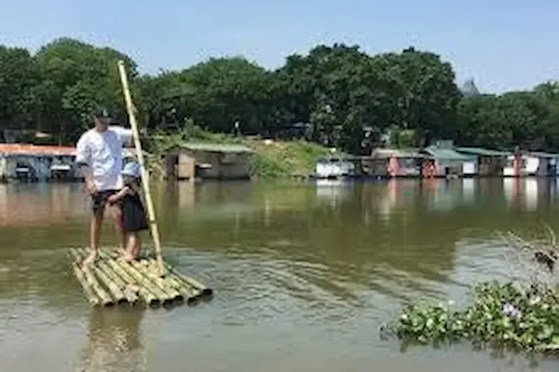 3. Local Villagers on a Bamboo Boat in Banana Island, Vietnam