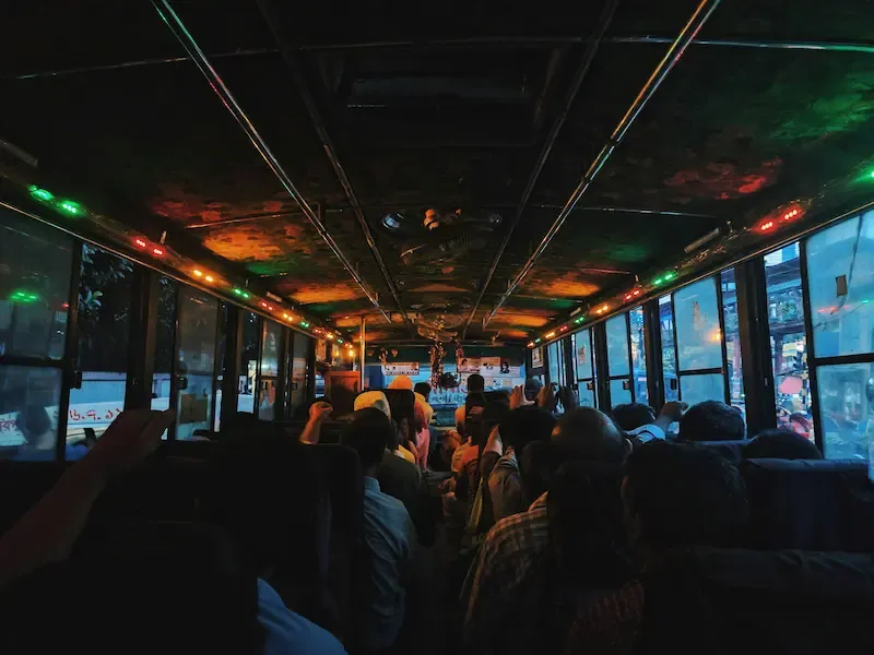 3. Tour Guide in a Vietnamese Mini Bus Going From Hanoi to Ninh Binh