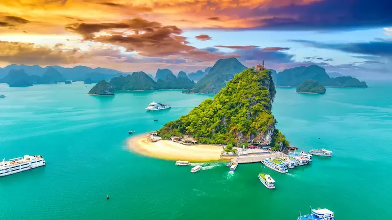 6. Ha Long Bay With a Boat Sailing in Background