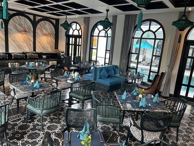 Modern Dining Area With Pool View at Hoi an Silk Village Restaurant