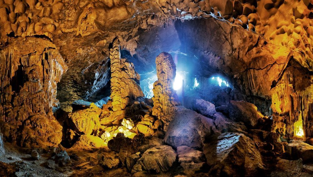 Illuminated Stalactites and Stalagmites Inside Sung Sot Cave.