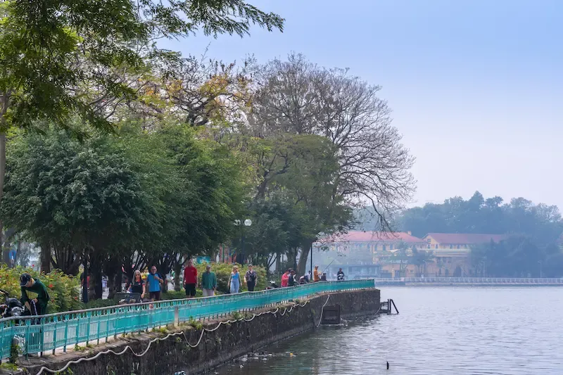 5. People Jog Around the Lake Area Near Tran Quoc Pagoda