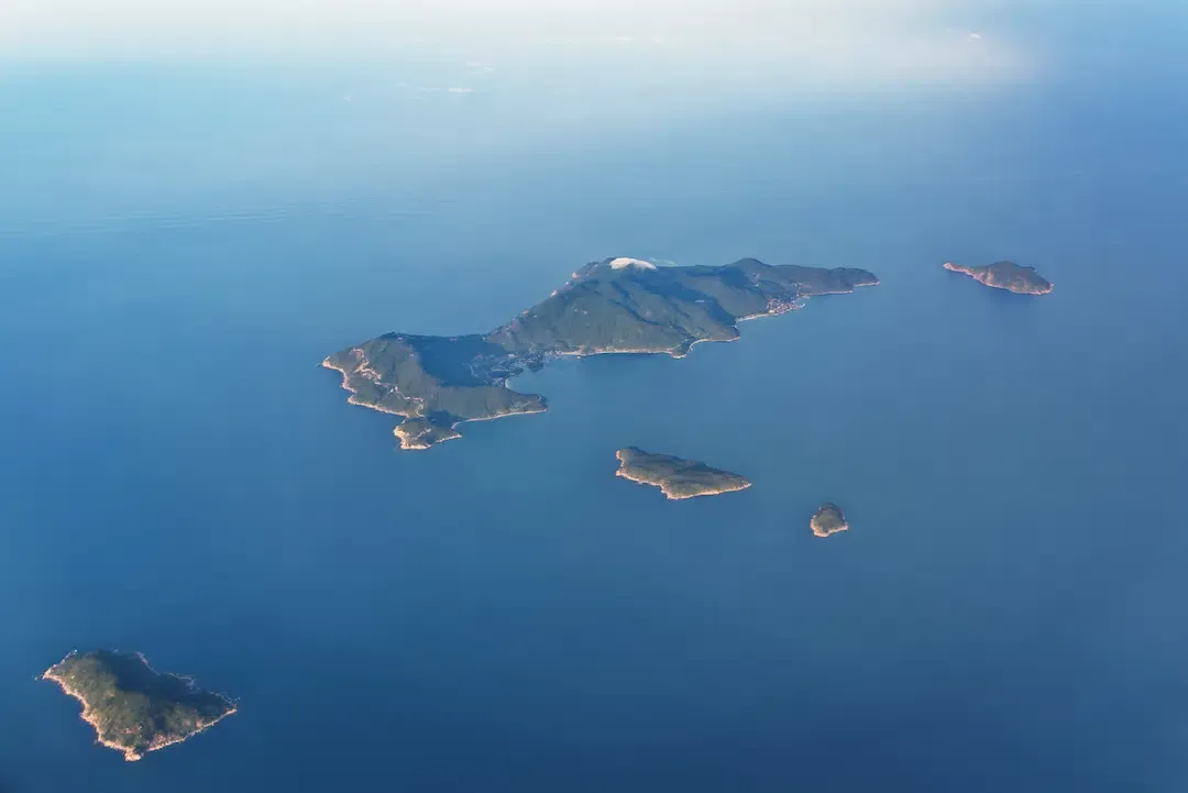 High angle aerial shot of the eight islands forming the Cham Island archipelago in Vietnam